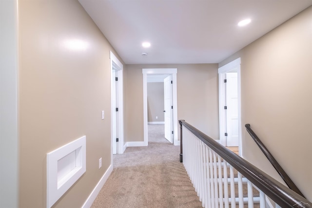 corridor with light colored carpet