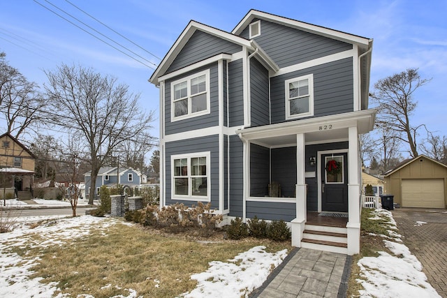 view of front of home featuring a garage and an outdoor structure