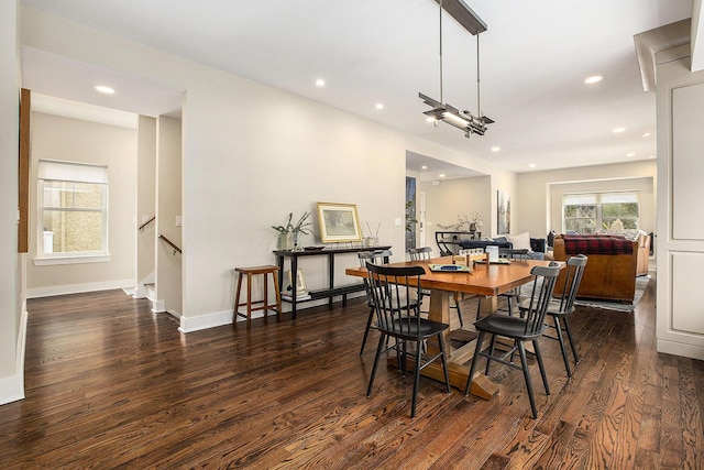 dining space with dark hardwood / wood-style floors