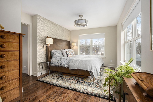 bedroom with dark hardwood / wood-style flooring