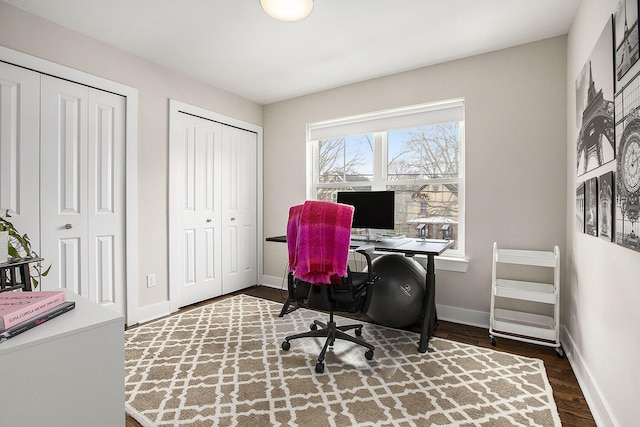 office space featuring dark wood-type flooring