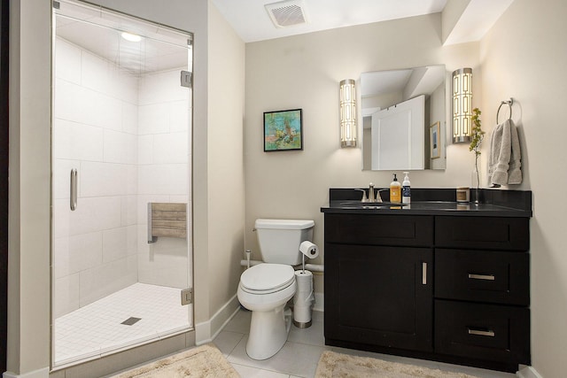 bathroom featuring tile patterned flooring, an enclosed shower, vanity, and toilet