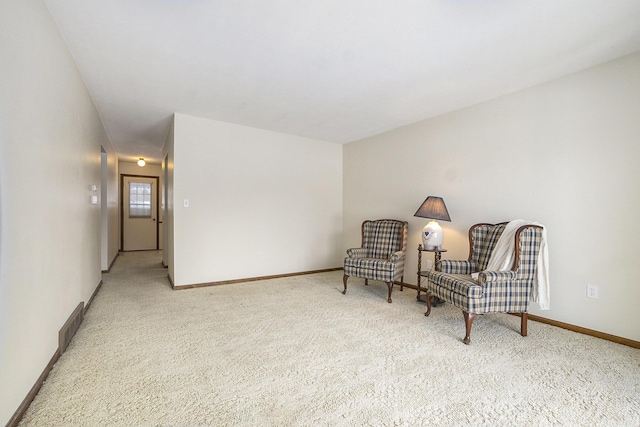 sitting room featuring carpet flooring