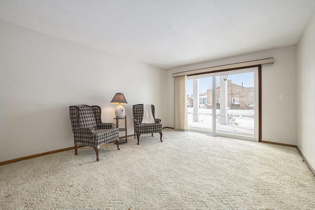 living area featuring carpet flooring