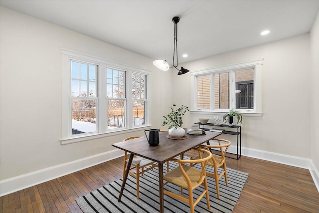 dining space featuring dark hardwood / wood-style floors