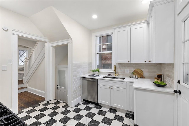 kitchen with white cabinetry, sink, and dishwasher