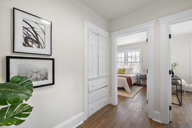 bedroom with dark hardwood / wood-style flooring