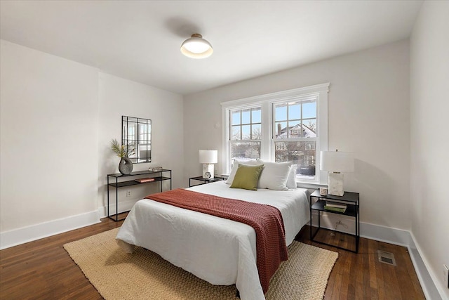 bedroom featuring dark hardwood / wood-style flooring