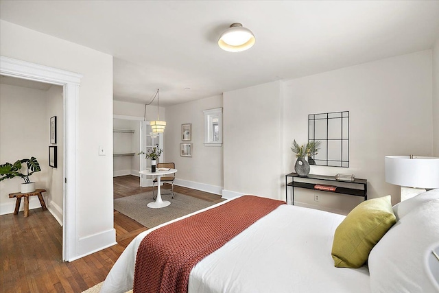 bedroom featuring dark wood-type flooring