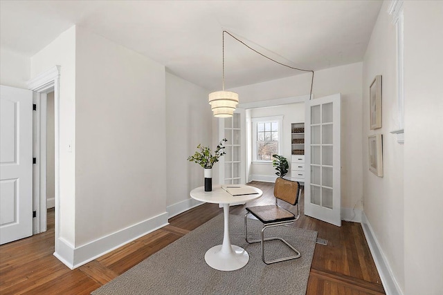 hallway with dark hardwood / wood-style flooring