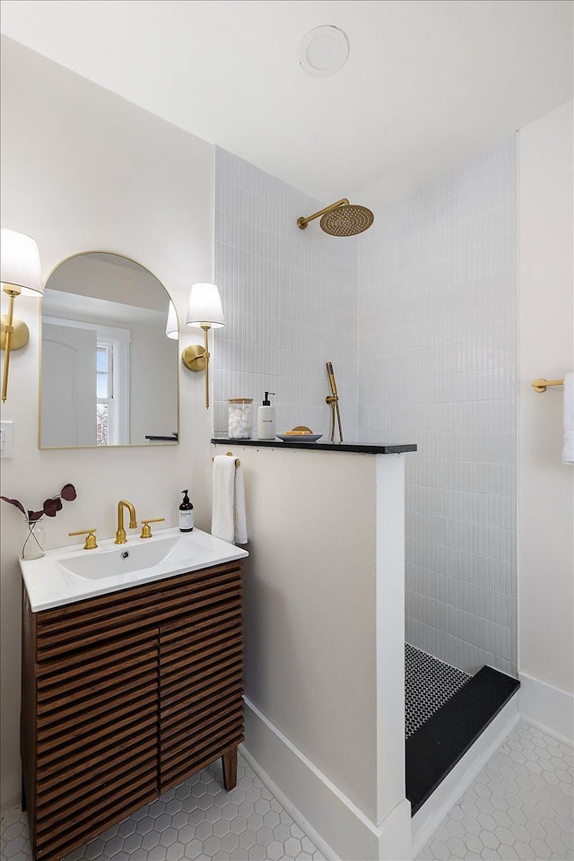 bathroom featuring vanity, tile patterned floors, and walk in shower