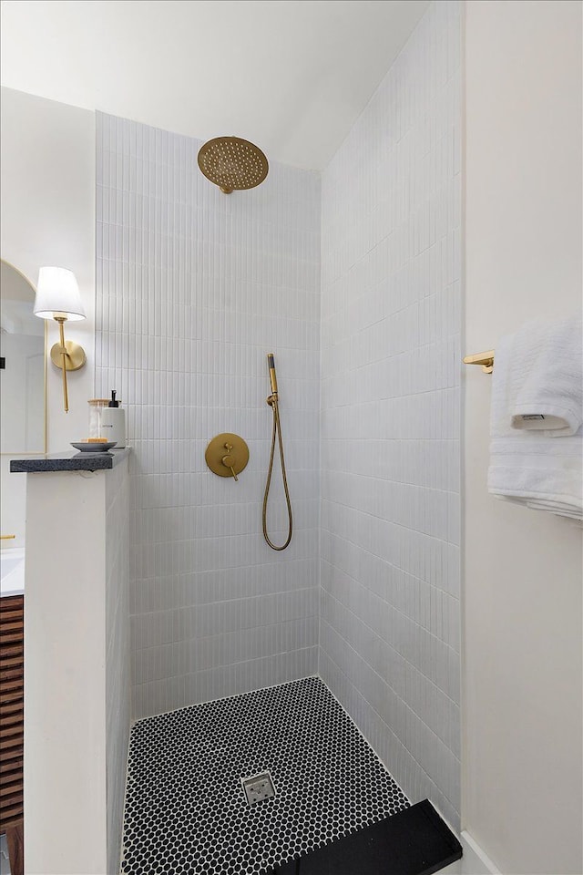 bathroom with a tile shower