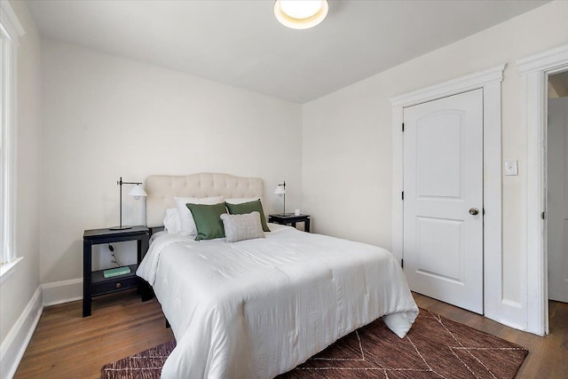 bedroom featuring dark hardwood / wood-style floors