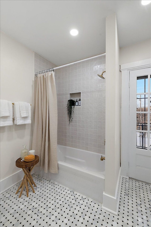 bathroom featuring tile patterned flooring and shower / bath combo