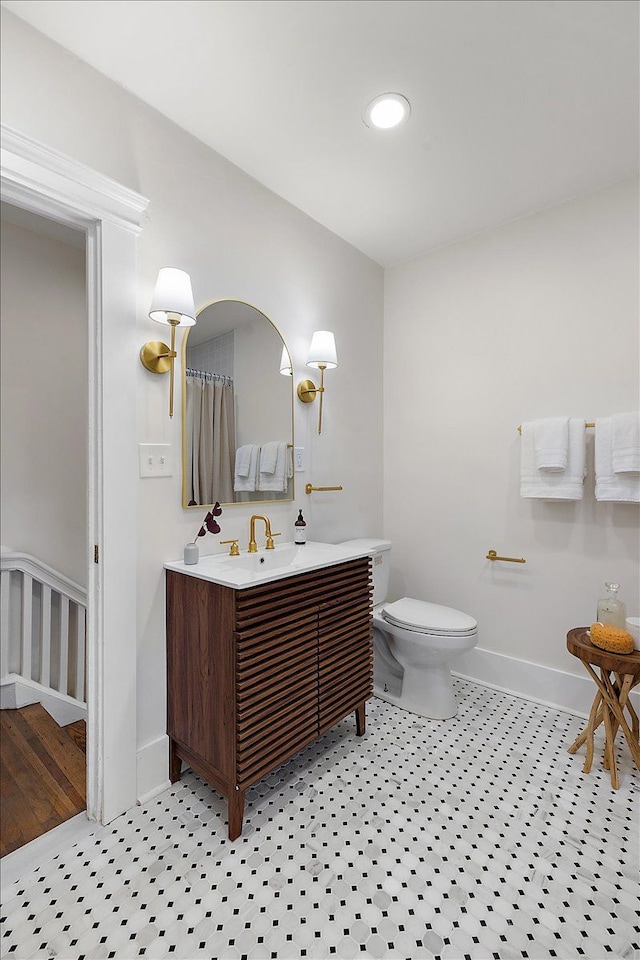 bathroom with vanity and toilet