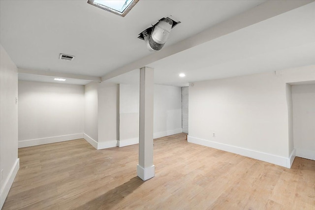 basement featuring light hardwood / wood-style floors