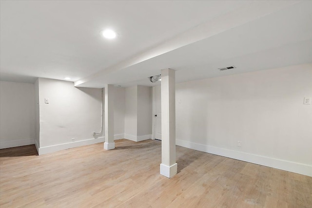 basement featuring light wood-type flooring