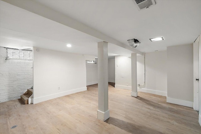 basement featuring light hardwood / wood-style floors