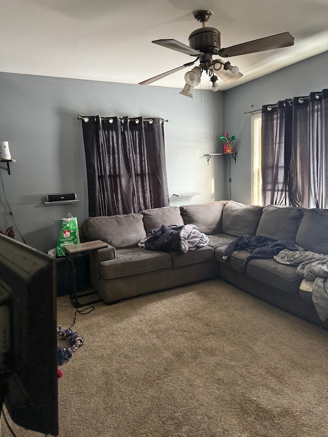 living room with carpet and ceiling fan