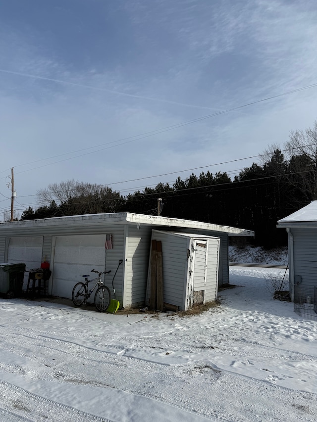 view of snow covered garage