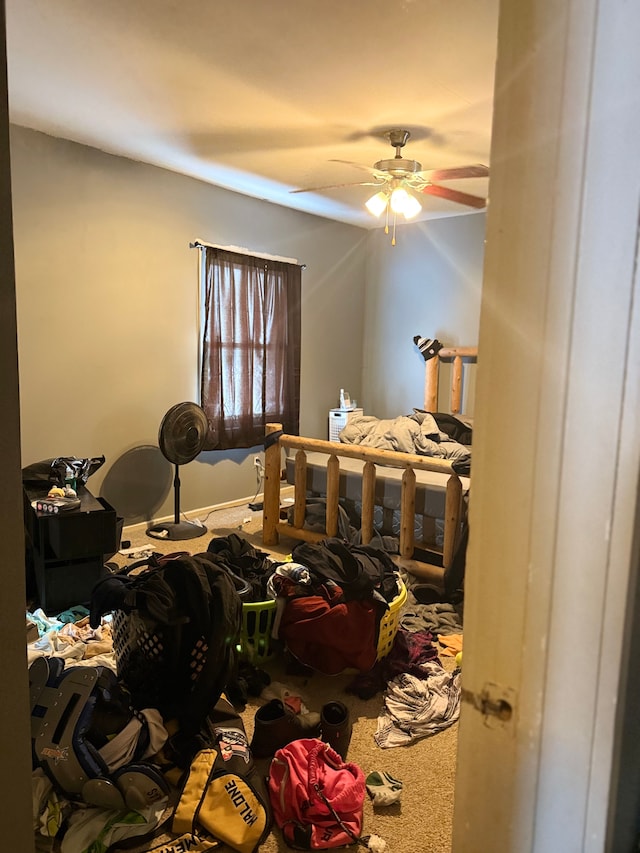 bedroom featuring ceiling fan and carpet floors