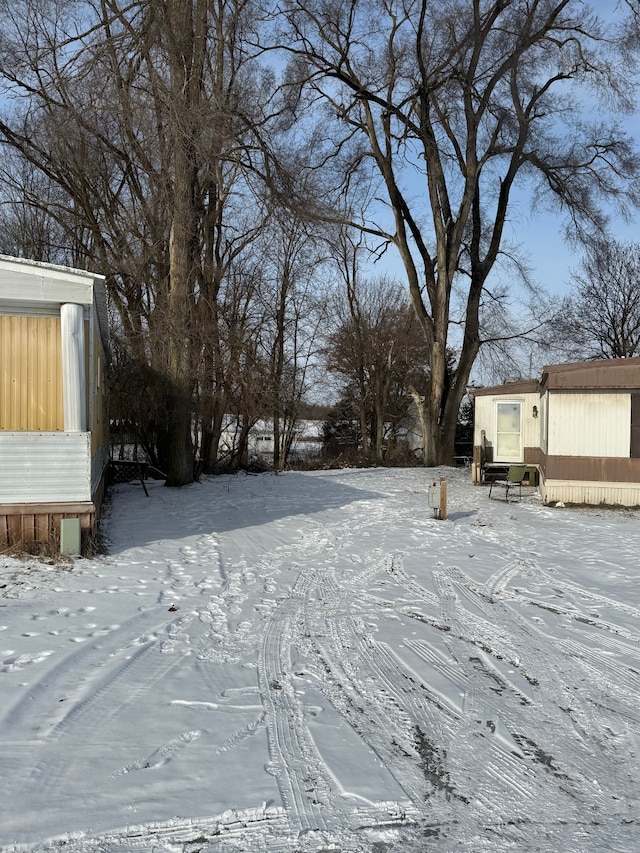 view of yard covered in snow