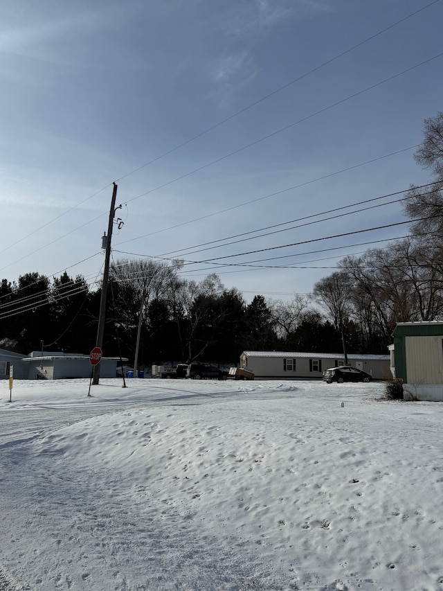 view of yard covered in snow