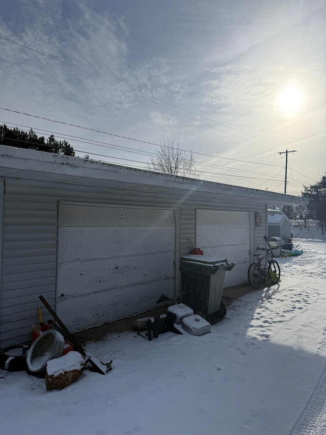 view of snow covered garage