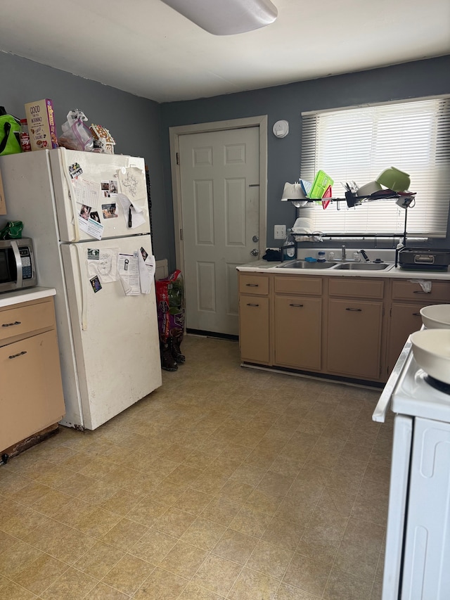 kitchen with sink and white appliances