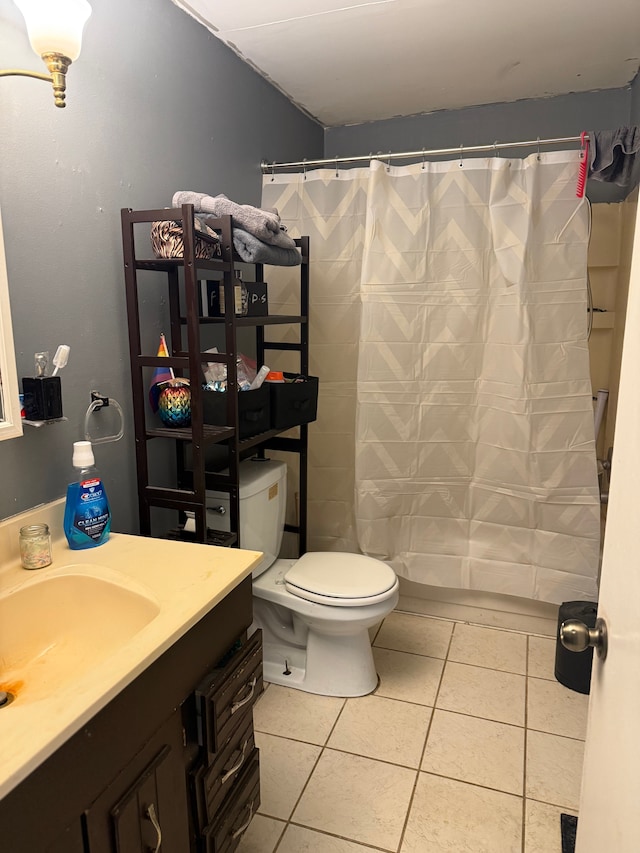 bathroom featuring a shower with curtain, tile patterned floors, toilet, and vanity