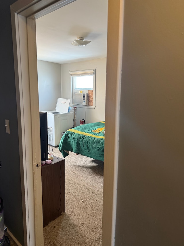 bedroom featuring cooling unit and carpet flooring