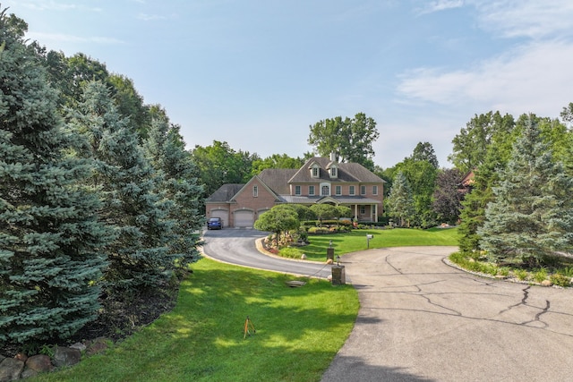 8557 Forestview Dr, Canton, MI 48187 - view of front of home featuring a front lawn, a garage, and asphalt driveway