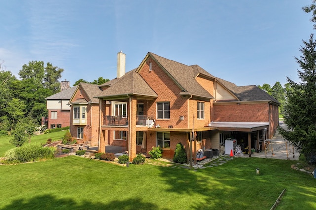 8557 Forestview Dr, Canton, MI 48187 - rear view of property featuring a patio area, brick siding, a chimney, and a lawn