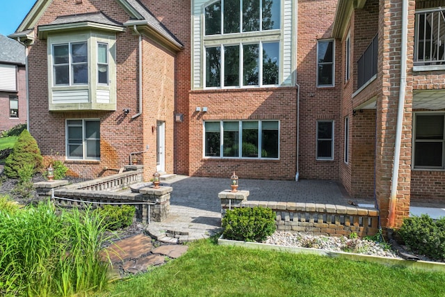 8557 Forestview Dr, Canton, MI 48187 - back of property with brick siding and a patio