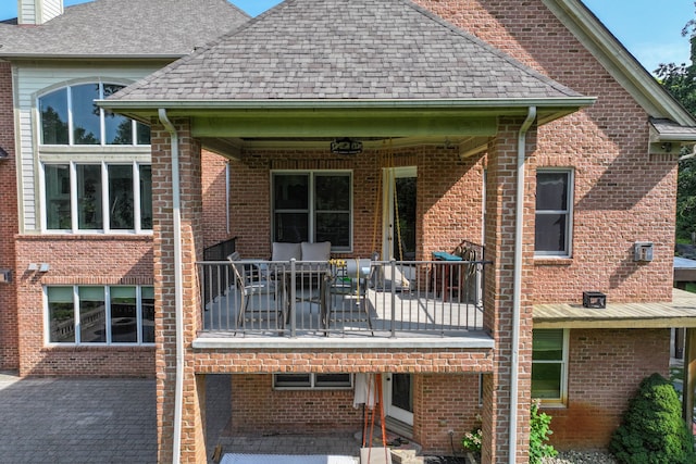 8557 Forestview Dr, Canton, MI 48187 - back of house with a shingled roof, a patio area, and brick siding