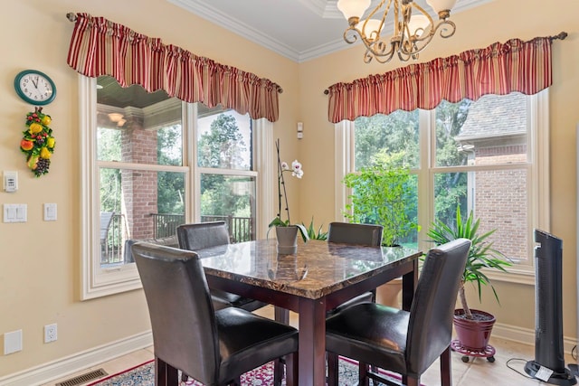 dining room with ornamental molding, a chandelier, and tile patterned flooring