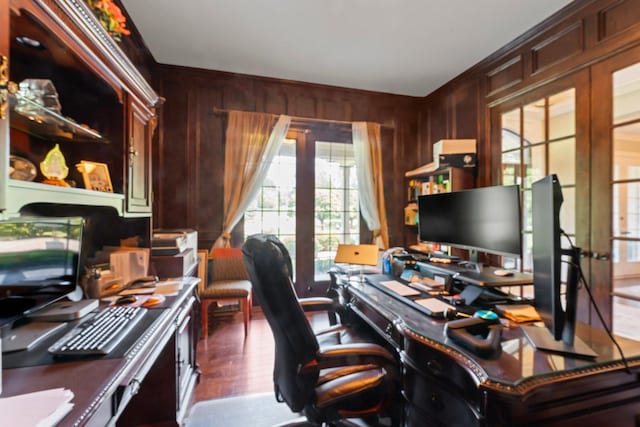 office space with wooden walls and french doors