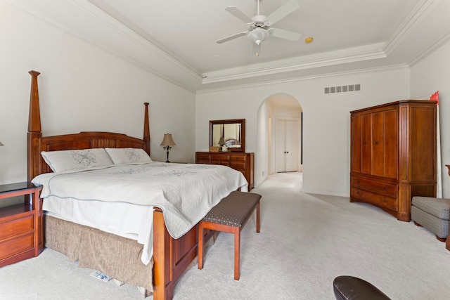 8557 Forestview Dr, Canton, MI 48187 - bedroom with arched walkways, a tray ceiling, crown molding, light carpet, and ceiling fan