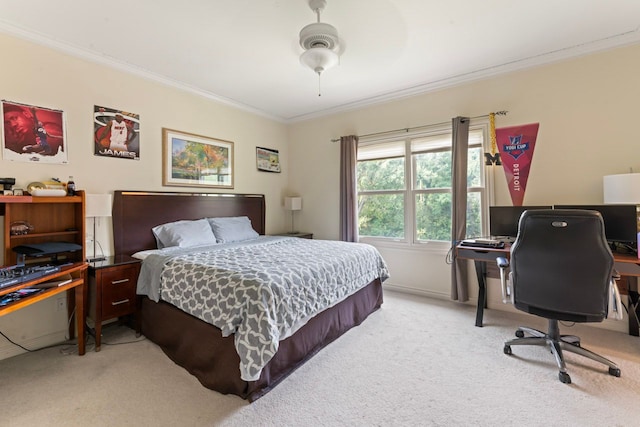 carpeted bedroom featuring crown molding and ceiling fan