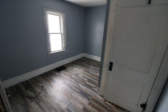 spare room featuring hardwood / wood-style floors