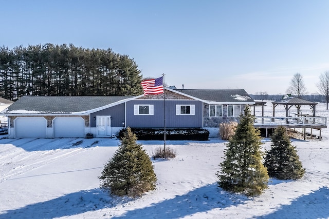 view of front of home with a gazebo and a garage