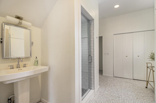 bathroom with sink and an enclosed shower