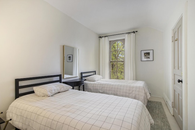 bedroom featuring vaulted ceiling