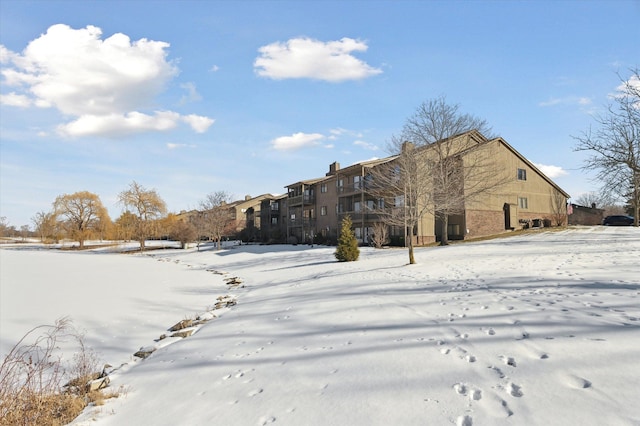 view of snow covered house