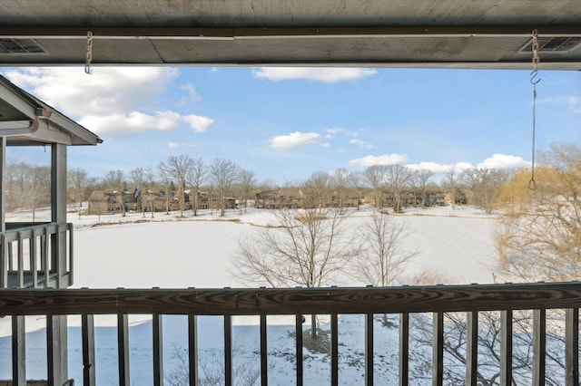 view of yard layered in snow