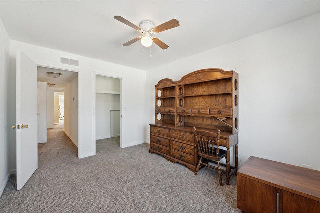 interior space featuring ceiling fan and light carpet