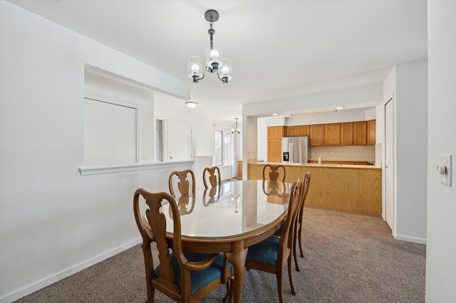 carpeted dining area with a notable chandelier