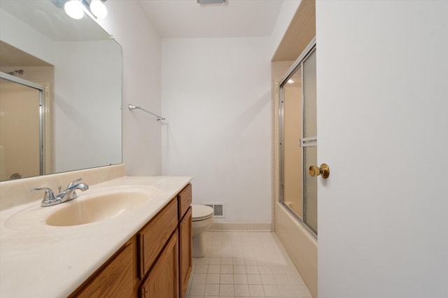 full bathroom with enclosed tub / shower combo, vanity, toilet, and tile patterned flooring