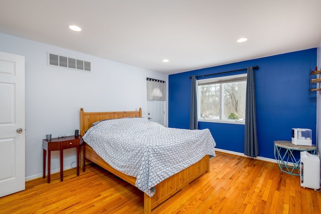 bedroom with light hardwood / wood-style floors