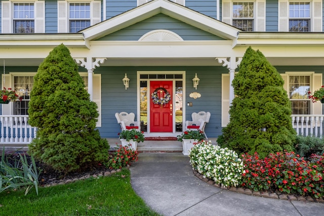 view of exterior entry featuring a porch